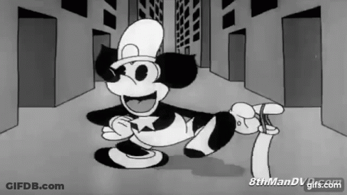Black And White Mickey Mouse In Top Hat Holding Paper GIF