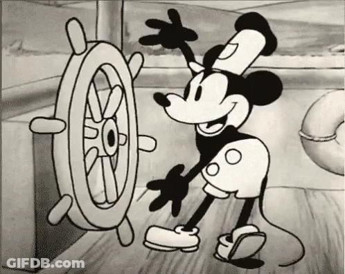 Black And White Mickey Mouse With Steering Wheel GIF