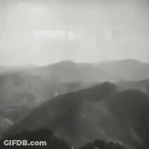 Black And White Mountain Range With Trees GIF