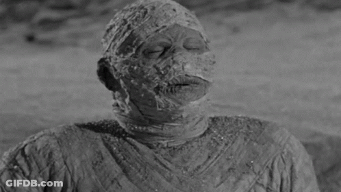 Black And White Mummy With Cigarette Mouth Open GIF