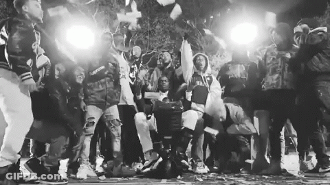 Black And White People Around Man With Money Bag GIF