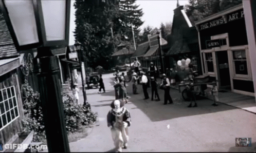 Black And White People Walking Past The News Art Gallery GIF