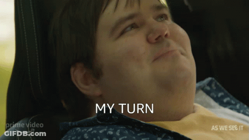 Black And White Person Holding Paper That Says It's My Turn To Torture You GIF