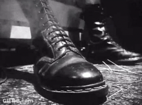 Black And White Person In Combat Boots GIF