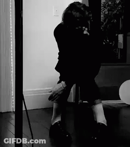 Black And White Person Kneeling GIF