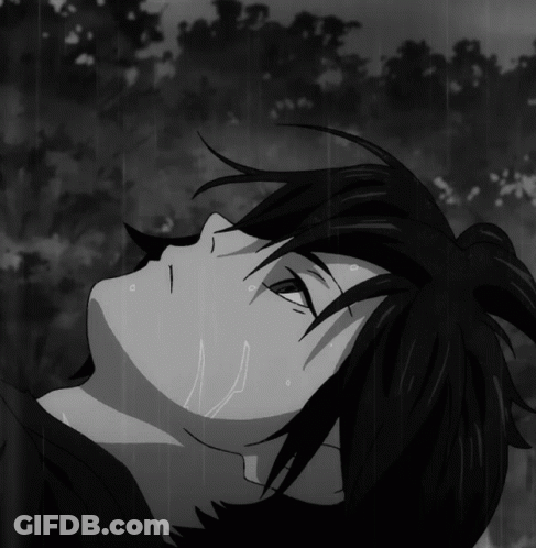 Black And White Person Laying In Rain GIF