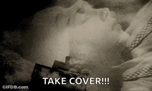 Black And White Person Lying In Bed Take Cover GIF
