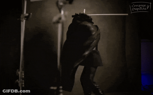 Black And White Person With Cinnamon And Chopsticks GIF
