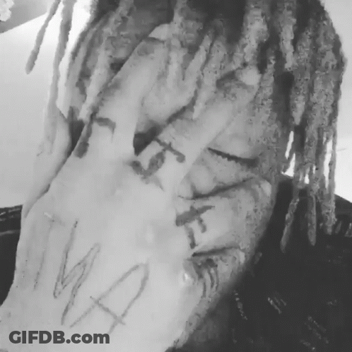 Black And White Person With Dreadlocks And Hand Tattoo GIF