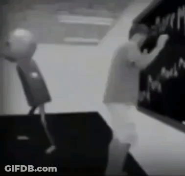 Black And White Person Writing On Blackboard GIF