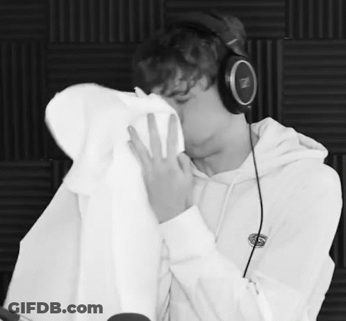 Black And White Photo Man In Headphones Kissing Another Man GIF
