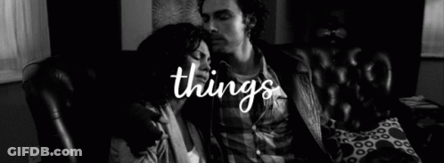Black And White Photo Man Kissing Woman On Cheek GIF