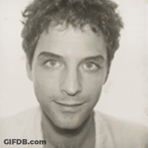 Black And White Photo Of A Man's Face GIF