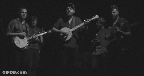 Black And White Photo Of Band Playing Guitars GIF