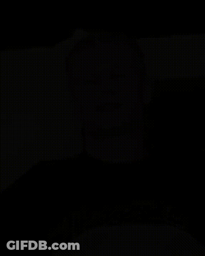 Black And White Photo Of Bearded Man In White Shirt GIF