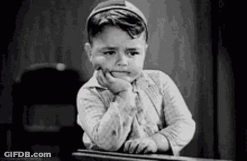 Black And White Photo Of Boy At Desk GIF