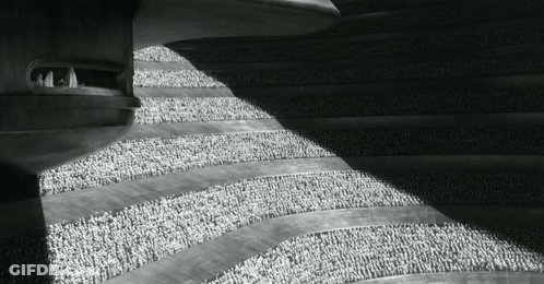 Black And White Photo Of Building With People GIF