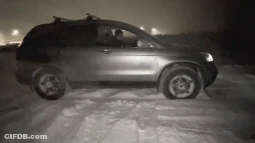Black And White Photo Of Car Driving In Snow GIF