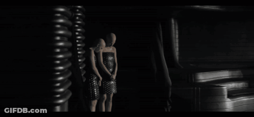 Black And White Photo Of Curtains Hanging In A Room GIF