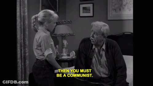 Black And White Photo Of Elderly Man And Little Girl Saying Then You Must Be A Communist GIF