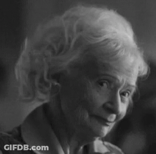 Black And White Photo Of Elderly Woman With Curly Hair GIF