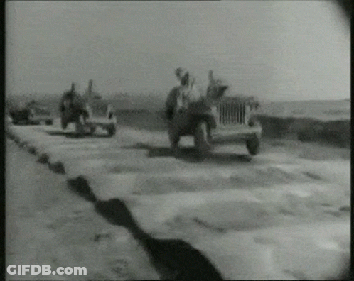 Black And White Photo Of Group Of Jeeps GIF