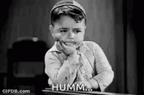 Black And White Photo Of Little Boy With Hand On Face GIF