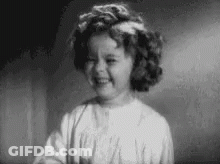 Black And White Photo Of Little Girl Smiling GIF