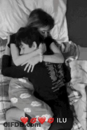 Black And White Photo Of Man And Woman Hugging Saying Ilu GIF