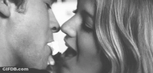 Black And White Photo Of Man And Woman Kissing GIF
