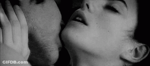 Black And White Photo Of Man And Woman Kissing GIF