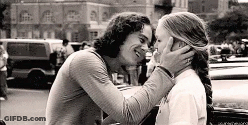 Black And White Photo Of Man And Woman Kissing GIF