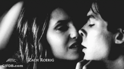 Black And White Photo Of Man And Woman Kissing GIF