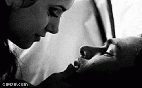 Black And White Photo Of Man And Woman Kissing GIF
