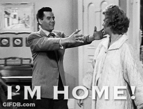 Black And White Photo Of Man And Woman Saying I'm Home GIF
