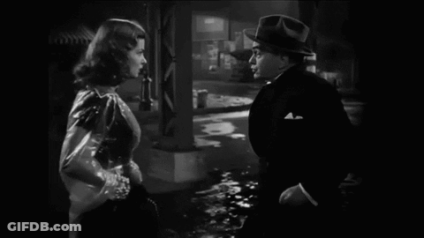 Black And White Photo Of Man And Woman Talking GIF