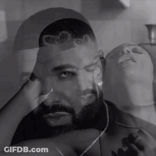 Black And White Photo Of Man And Woman With Drake On His Head GIF
