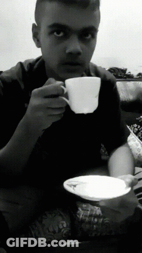 Black And White Photo Of Man Drinking From Cup GIF