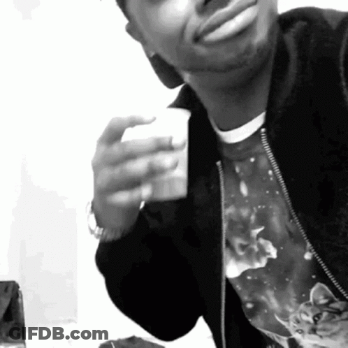 Black And White Photo Of Man Holding Coffee GIF
