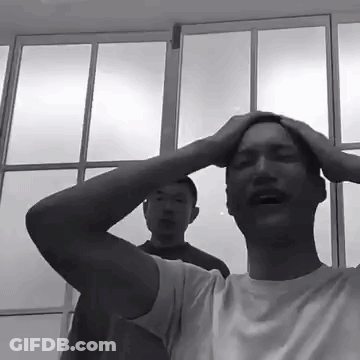 Black And White Photo Of Man Holding Head GIF