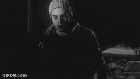Black And White Photo Of Man In Beanie And Jacket GIF