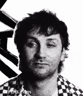 Black And White Photo Of Man In Checkered Shirt GIF