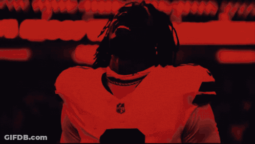 Black And White Photo Of Man In NFL Jersey GIF