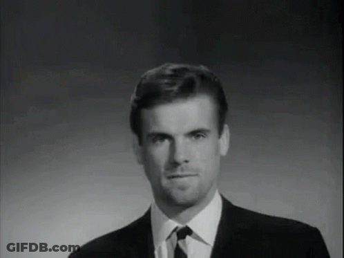 Black And White Photo Of Man In Suit And Tie GIF