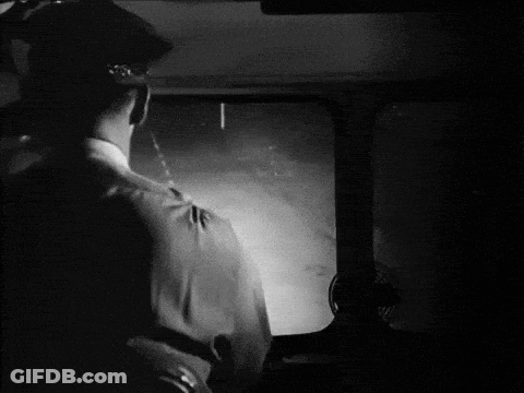 Black And White Photo Of Man Looking Out Window GIF