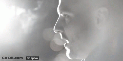 Black And White Photo Of Man Saying Oh Speak Low GIF