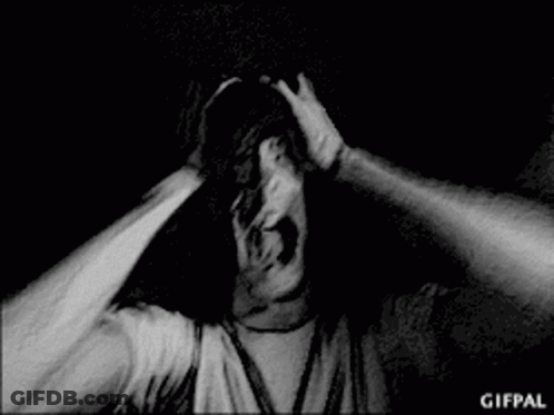 Black And White Photo Of Man Screaming With Arms Outstretched GIF