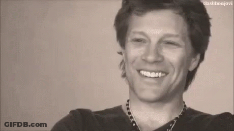 Black And White Photo Of Man Smiling With Teeth GIF