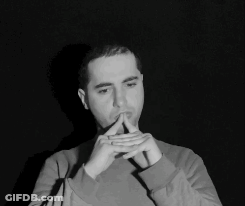 Black And White Photo Of Man With Hands On Chin GIF