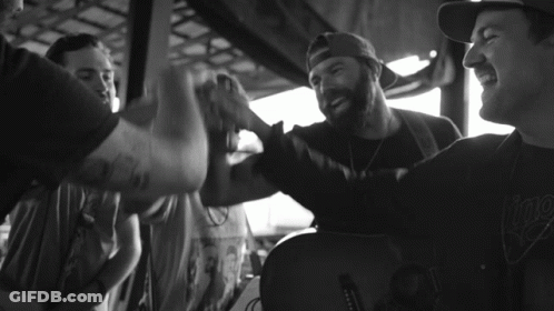 Black And White Photo Of Man With I Play Tattoo GIF